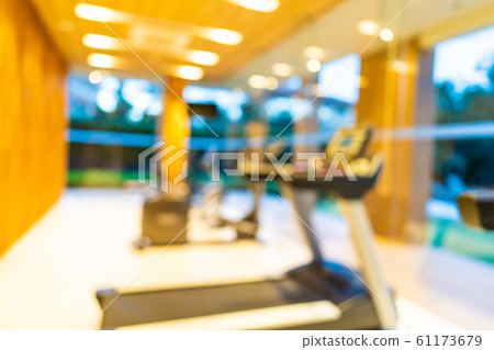 Abstract blur gym room interior with fitness equipment Abstract blur gym room interior with fitness equipment 61173679