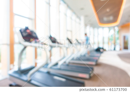 Abstract blur gym room interior with fitness equipment 61173700