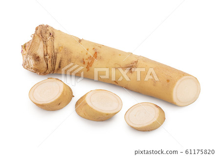 Horseradish root with slices isolated on white background 61175820