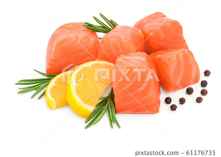 raw salmon piece cube with rosemary, lemon and peppercorn isolated on white background close up raw salmon piece cube with rosemary, lemon and peppercorn isolated on white background close up 61176735