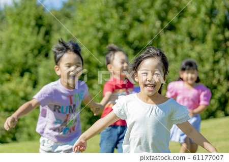 Children running in the park Children running in the park 61177007