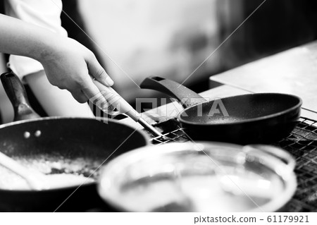 Chef cooking in a kitchen, chef at work, Black & Chef cooking in a kitchen, chef at work, Black & 61179921