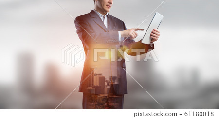 Businessman use tablet pc Businessman use tablet pc 61180018