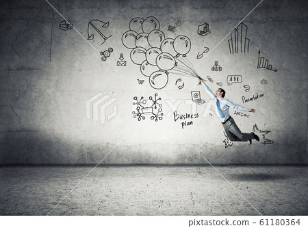 Businessman fly on balloons 61180364