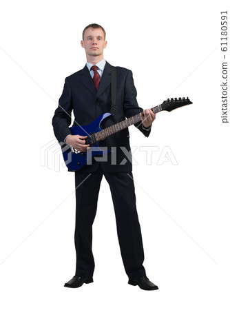 Businessman playing guitar 61180591