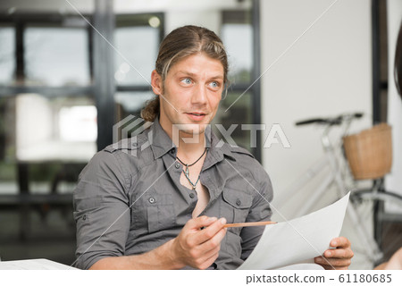 Handsome guy at computer work 61180685