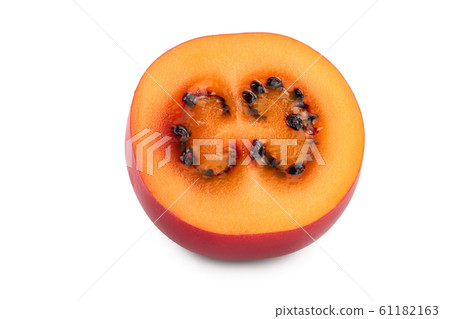 Fresh tamarillo fruit half isolated on white background Fresh tamarillo fruit half isolated on white background 61182163