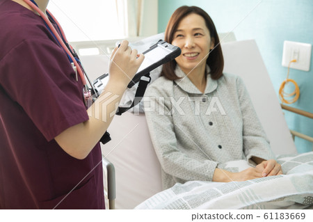 Women Business Job Doctor Nurse Hospital Electronic Medical Record Tablet Patient Counseling Consultation 61183669