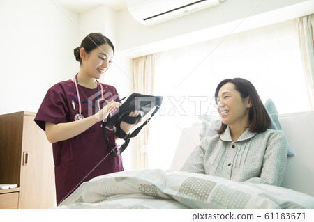 Women Business Job Doctor Nurse Hospital Electronic Medical Record Tablet Patient Counseling Consultation 61183671