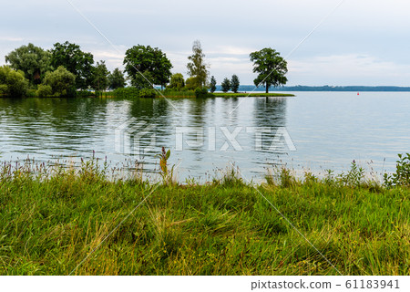 Scenic view of Schweriner Innensee lake in Schwerin, Germany Scenic view of Schweriner Innensee lake in Schwerin, Germany 61183941