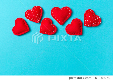 Composition of textile red hearts on colorful Composition of textile red hearts on colorful 61189260