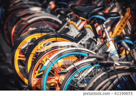 Share electric bikes parked on the sidewalk, Hangzhou 61190655
