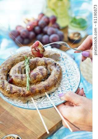 Homemade sausage on a plate.  61190873