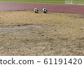 Soccer ball and grass and track 61191420
