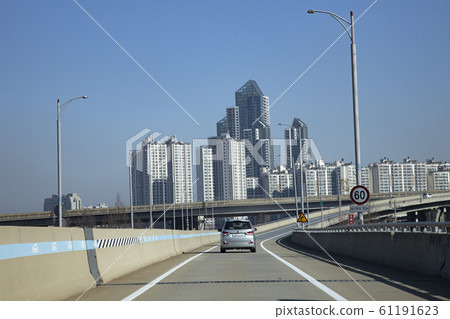 Road and apartment complex 61191623