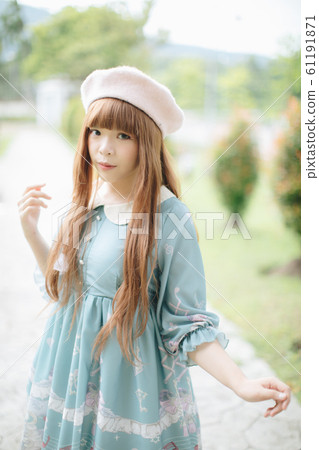 Portrait of asian girl in lolita fashion dress in garden background 61191871