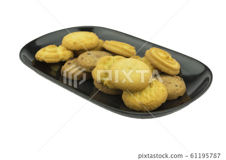 Cookies on a plate on a white background. 61195787