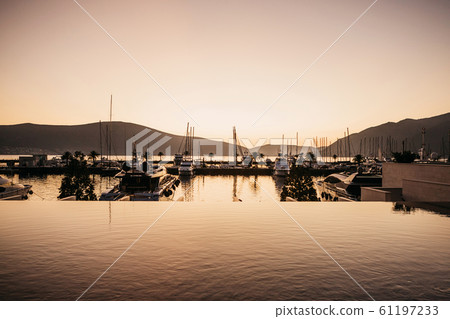 Beautiful view of yachts at sunset Beautiful view of yachts at sunset 61197233