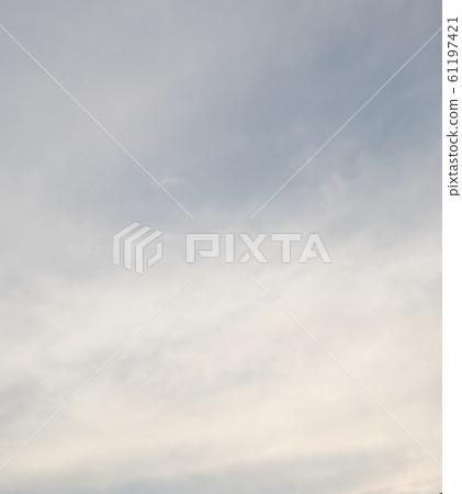 Blue sky with white clouds as a background. 61197421