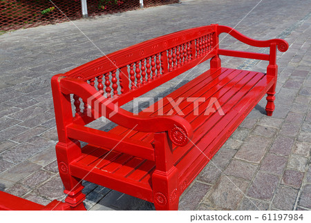 Red wooden bench outdoors in Doha, Qatar Red wooden bench outdoors in Doha, Qatar 61197984