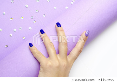 Stylish trendy women's manicure. Blue and lilac Stylish trendy women's manicure. Blue and lilac 61198699