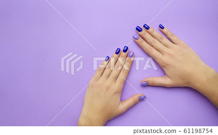 Stylish trendy women's manicure. Blue and lilac Stylish trendy women's manicure. Blue and lilac 61198754