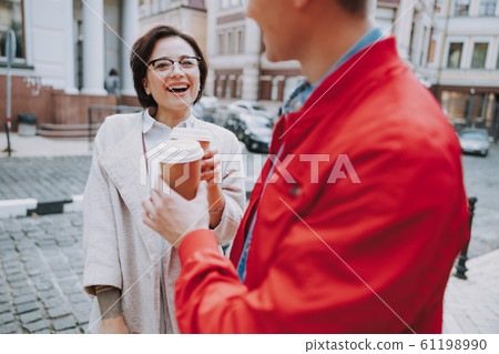 Happy friends walking together in the city 61198990