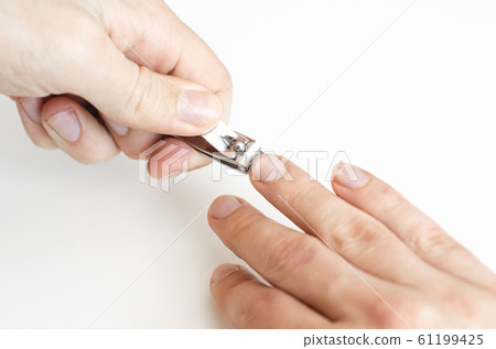 A young man does a manicure. Photo. A young man does a manicure. Photo. 61199425