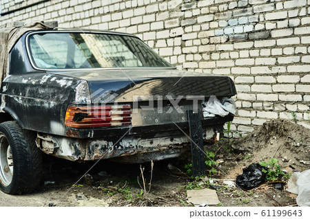 Details of old car. Aged oldtimer vintage automobile. Spare parts of retro classic automobile. Disassembled car in a parking lot 61199643
