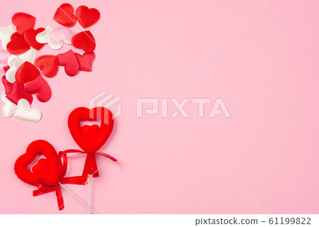 Red hearts for Valentine's day on a beautiful pink background. 61199822