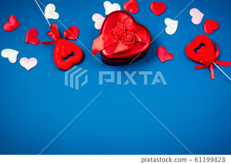 Red heart with a gift for Valentine's Day 61199828