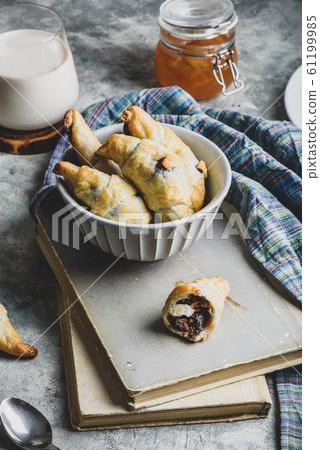 Croissants stuffed with nuts and chocolate spread Croissants stuffed with nuts and chocolate spread 61199985