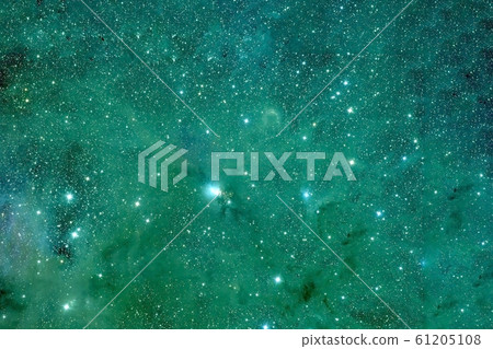 Green nebula with a bright cloud and stars. 61205108