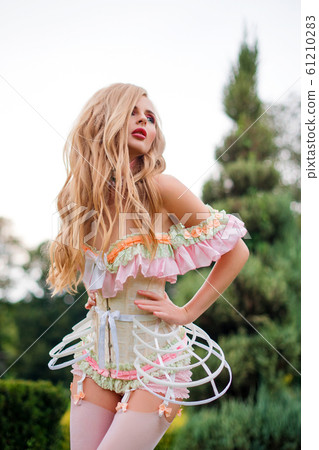 beautiful women wearing sexy lingerie Beautiful young woman wearing sexy lingerie posing with her arm above her  head Stock Photo main image 1