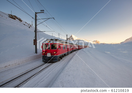 Red train during the passage of the Bernina pass Red train during the passage of the Bernina pass 61210819
