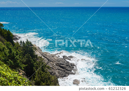 Beautiful cerulean sea and the rocky beach Beautiful cerulean sea and the rocky beach 61212326