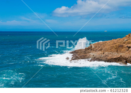 Beautiful cerulean sea and the rock Beautiful cerulean sea and the rock 61212328