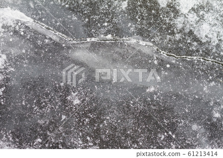 ice surface of frozen lake 61213414