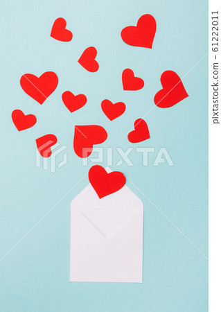 Red hearts in an open white envelope Red hearts in an open white envelope 61222011