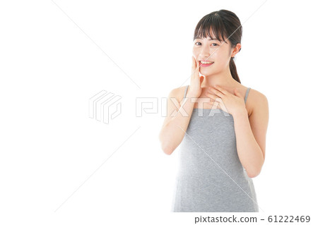 A young woman doing beauty care A young woman doing beauty care 61222469