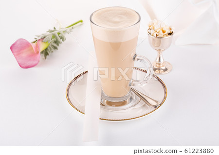 Coffee latte with popcorn and pink flower in service Coffee latte with popcorn and pink flower in service 61223880