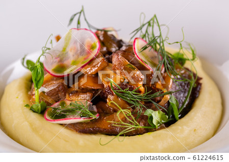 Fried fox mushrooms with greens and radish, served with puree potatoes 61224615