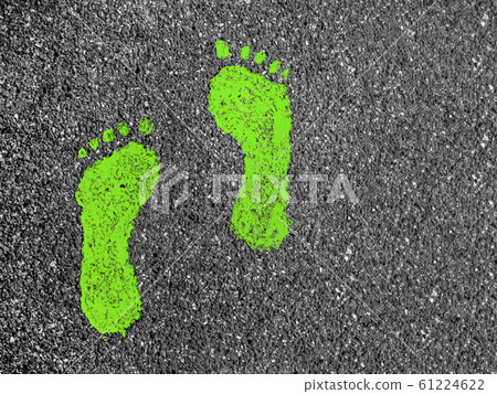 Green footprints on asphalt Green footprints on asphalt 61224622