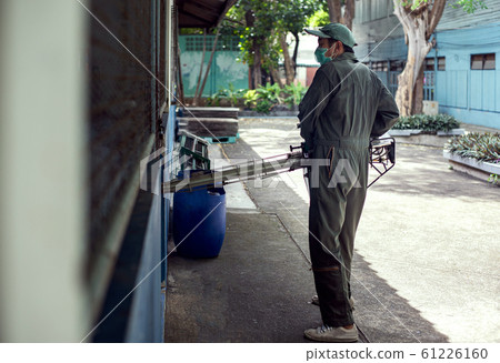 Man work fogging to eliminate mosquito for preventing spread dengue fever Man work fogging to eliminate mosquito for preventing spread dengue fever 61226160