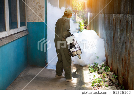 Man work fogging to eliminate mosquito for preventing spread dengue fever Man work fogging to eliminate mosquito for preventing spread dengue fever 61226163