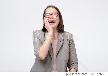 Laughing mature businesswoman in glasses laughing on joke. Laughing mature businesswoman in glasses laughing on joke. 61227665