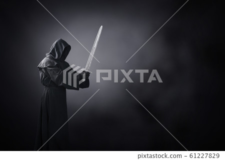 Ghostly figure with medieval sword in the dark Ghostly figure with medieval sword in the dark 61227829