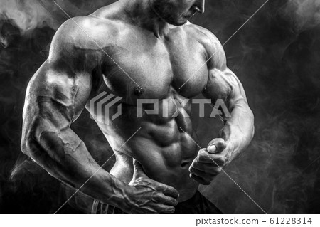 Unrecognizable Strong bodybuilder man with perfect abs, shoulders,biceps, triceps, chest 61228314