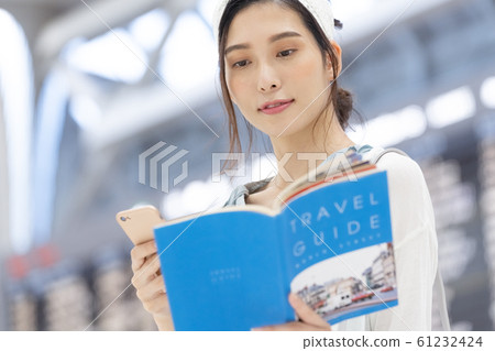Airport Travel Woman Guidebook 61232424