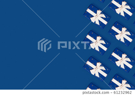 Blue gift boxes on a blue background. 61232962